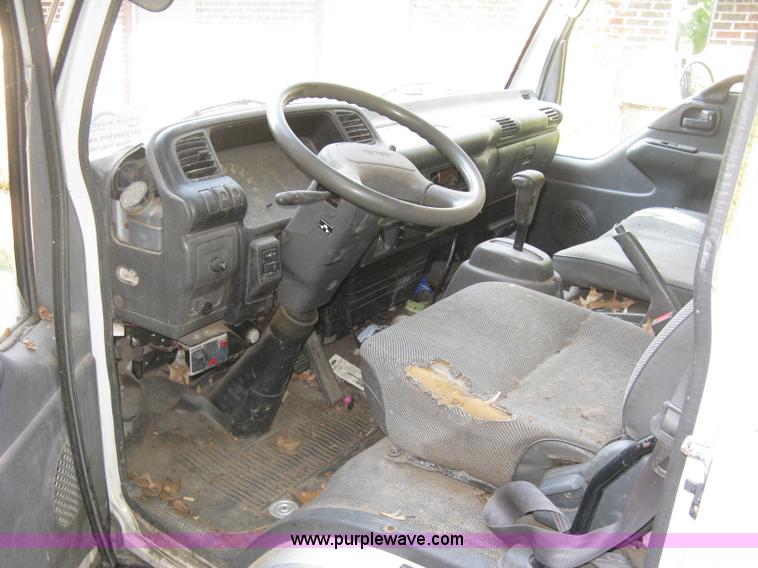 image for item E7965 2001 Isuzu NQR flatbed dump truck