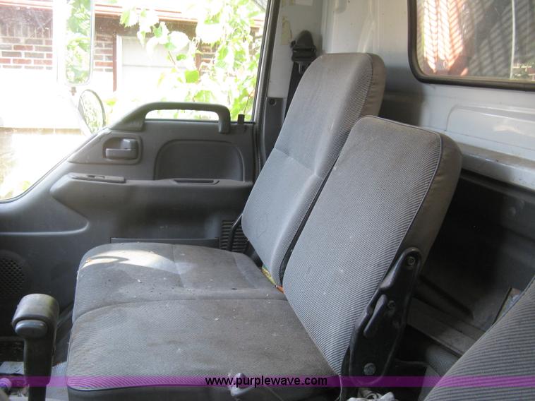 image for item E7965 2001 Isuzu NQR flatbed dump truck