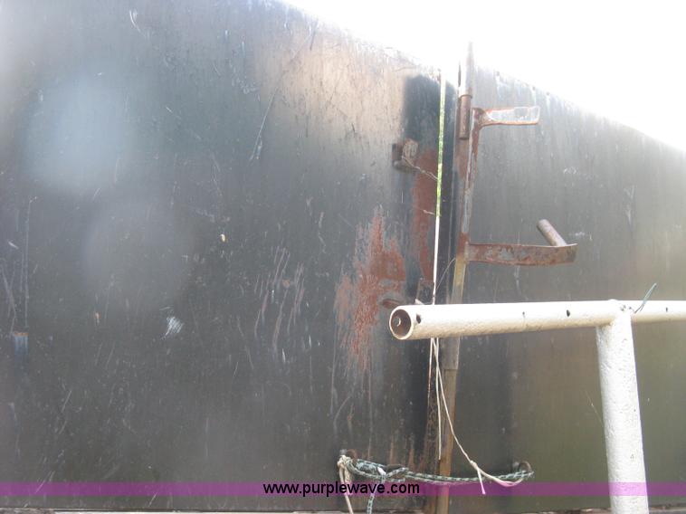 image for item E7965 2001 Isuzu NQR flatbed dump truck