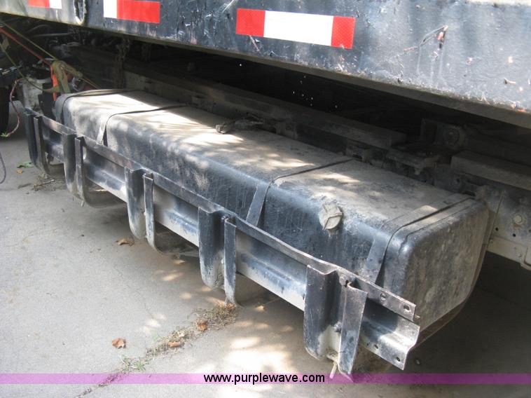image for item E7965 2001 Isuzu NQR flatbed dump truck