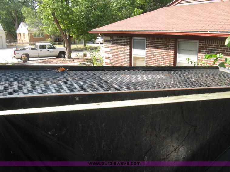 image for item E7965 2001 Isuzu NQR flatbed dump truck