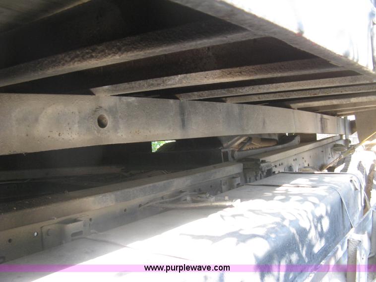 image for item E7965 2001 Isuzu NQR flatbed dump truck