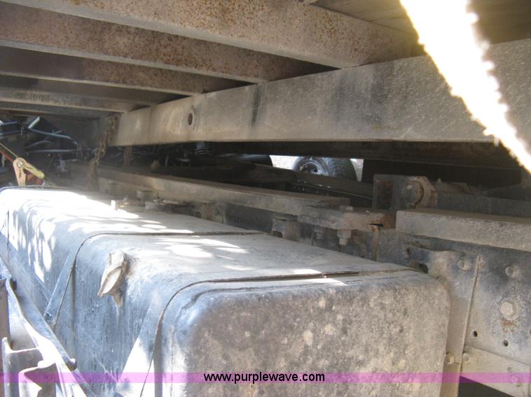 image for item E7965 2001 Isuzu NQR flatbed dump truck