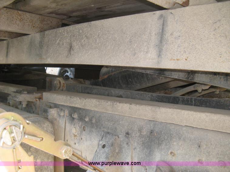 image for item E7965 2001 Isuzu NQR flatbed dump truck