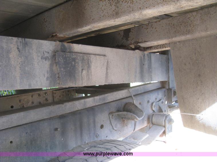 image for item E7965 2001 Isuzu NQR flatbed dump truck