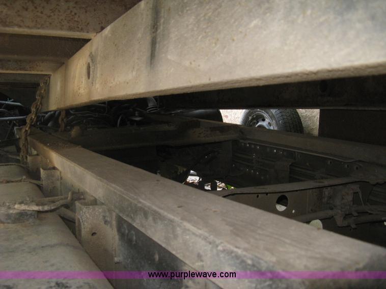 image for item E7965 2001 Isuzu NQR flatbed dump truck