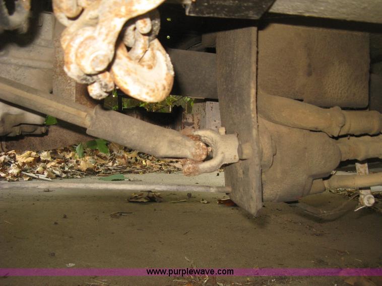 image for item E7965 2001 Isuzu NQR flatbed dump truck