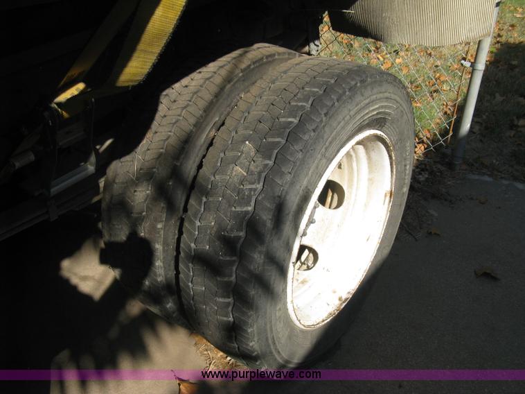 image for item E7965 2001 Isuzu NQR flatbed dump truck