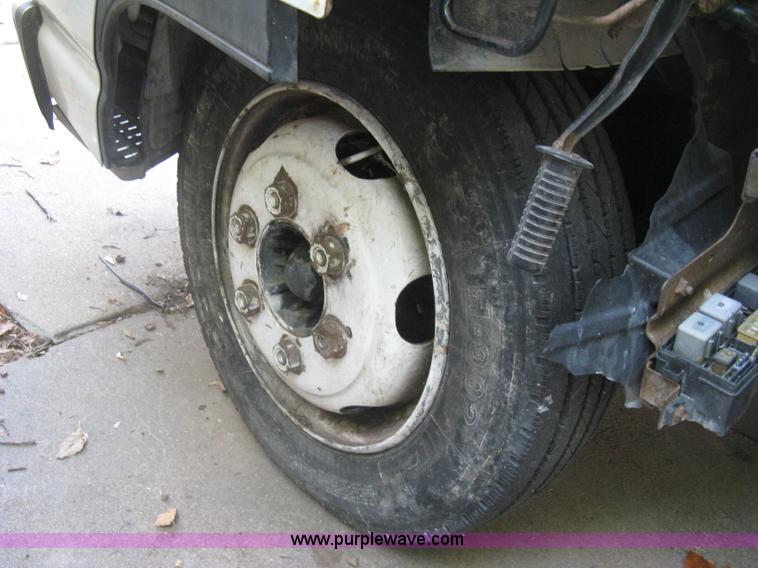 image for item E7965 2001 Isuzu NQR flatbed dump truck