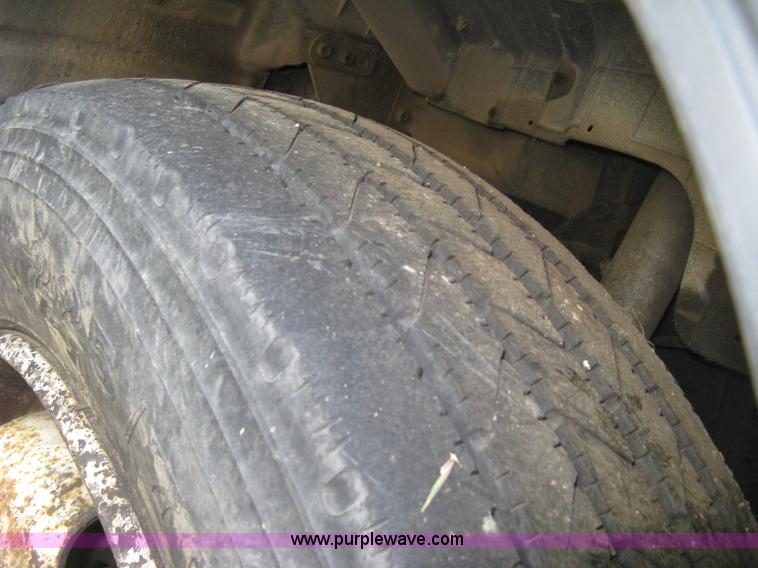 image for item E7965 2001 Isuzu NQR flatbed dump truck