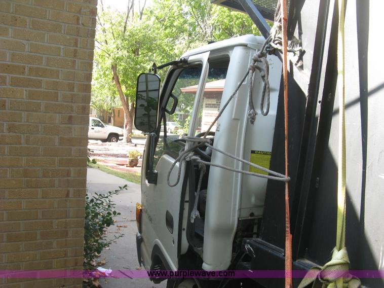 image for item E7965 2001 Isuzu NQR flatbed dump truck