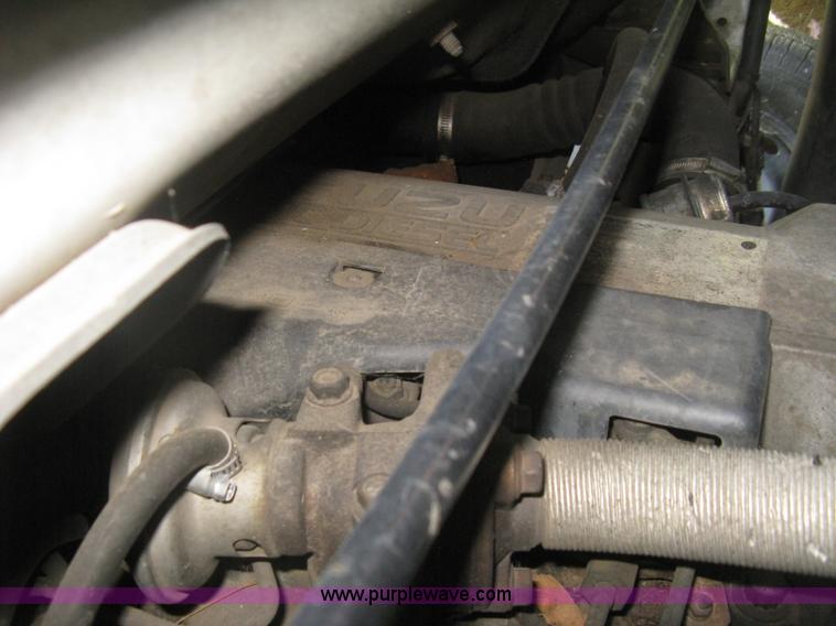 image for item E7965 2001 Isuzu NQR flatbed dump truck