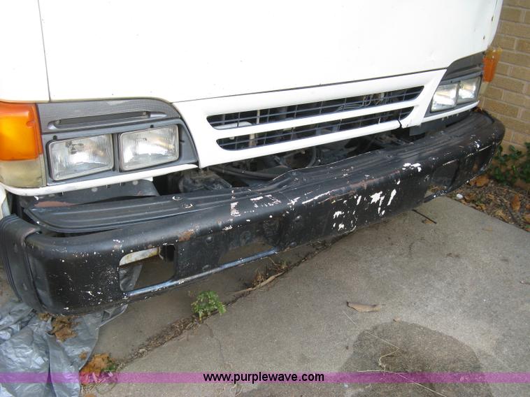 image for item E7965 2001 Isuzu NQR flatbed dump truck