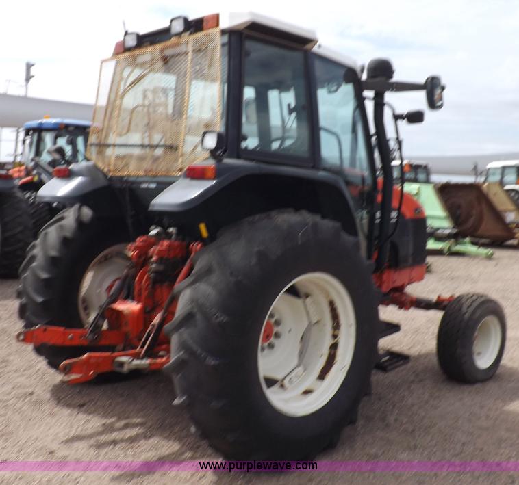 image for item H9104 2000 New Holland TS100 tractor