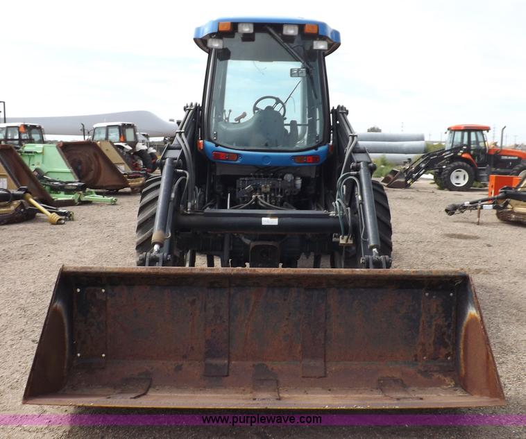 image for item H9106 1999 New Holland TV140 bi-directional MFWD tractor