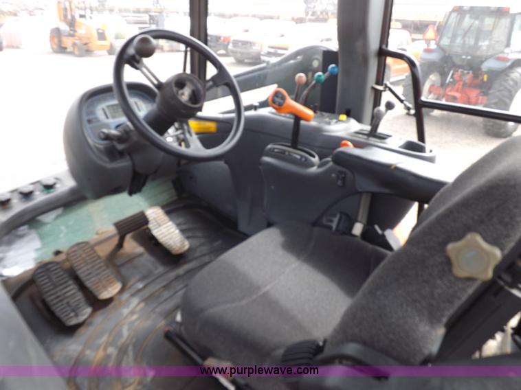 image for item H9106 1999 New Holland TV140 bi-directional MFWD tractor