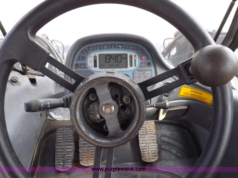 image for item H9106 1999 New Holland TV140 bi-directional MFWD tractor