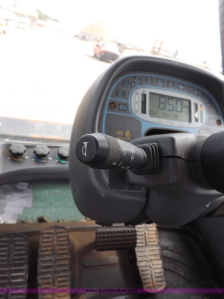 image for item H9106 1999 New Holland TV140 bi-directional MFWD tractor