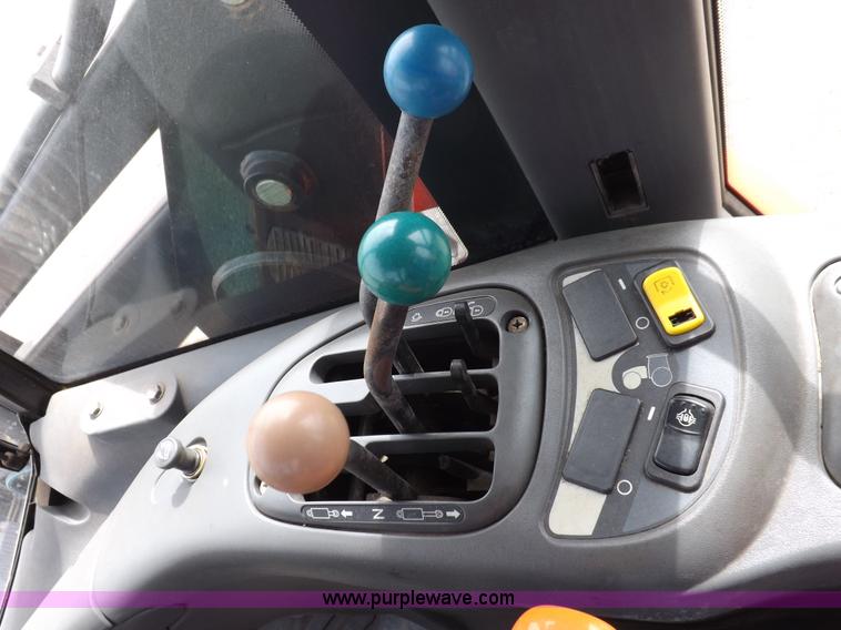 image for item H9106 1999 New Holland TV140 bi-directional MFWD tractor