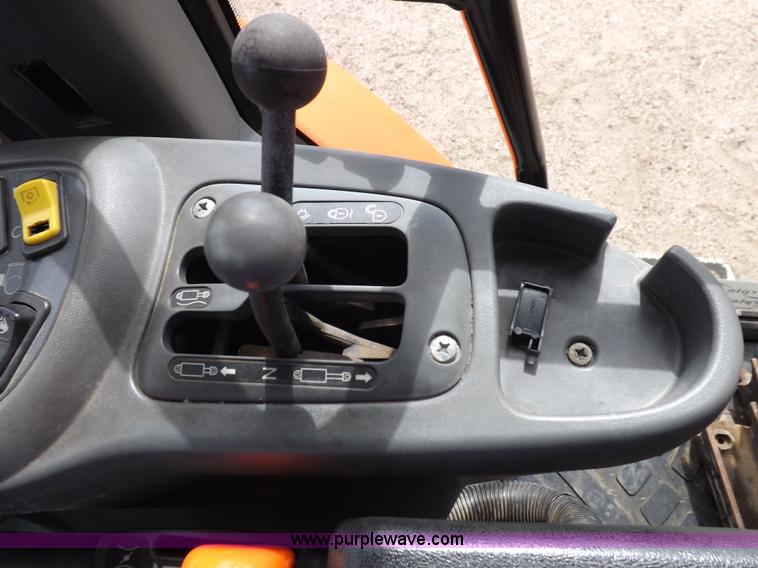 image for item H9106 1999 New Holland TV140 bi-directional MFWD tractor