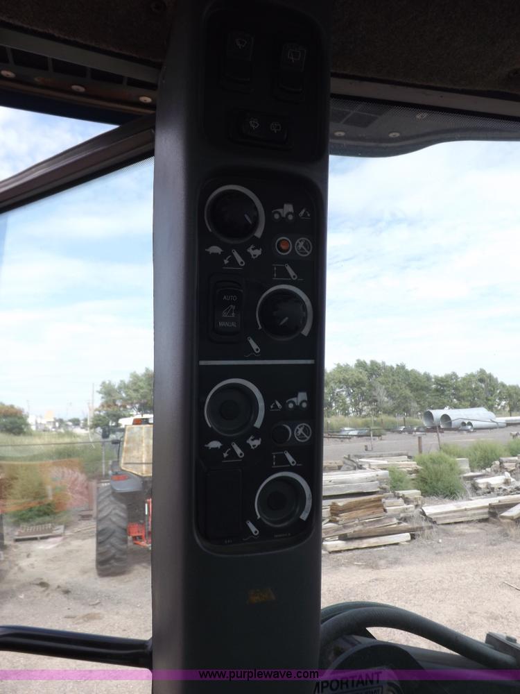 image for item H9106 1999 New Holland TV140 bi-directional MFWD tractor