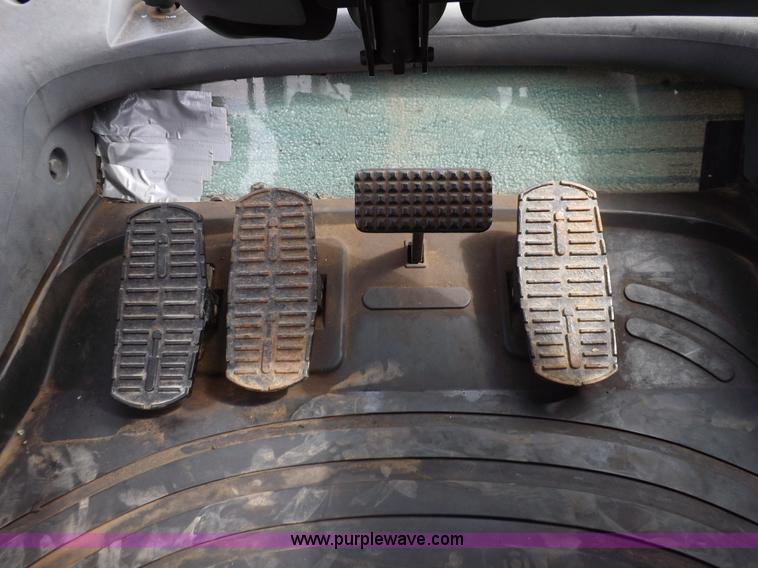 image for item H9106 1999 New Holland TV140 bi-directional MFWD tractor