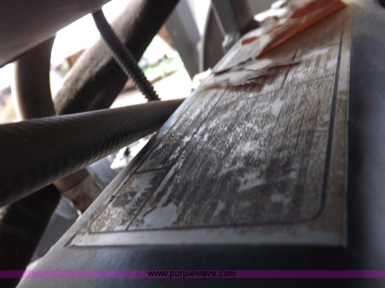 image for item H9106 1999 New Holland TV140 bi-directional MFWD tractor