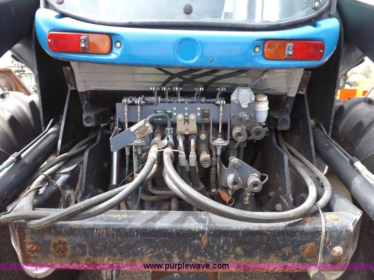 image for item H9106 1999 New Holland TV140 bi-directional MFWD tractor