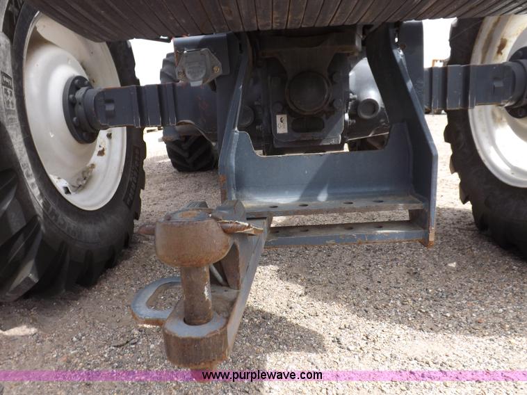 image for item H9106 1999 New Holland TV140 bi-directional MFWD tractor