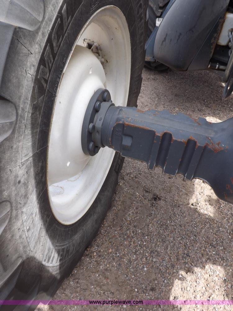 image for item H9106 1999 New Holland TV140 bi-directional MFWD tractor