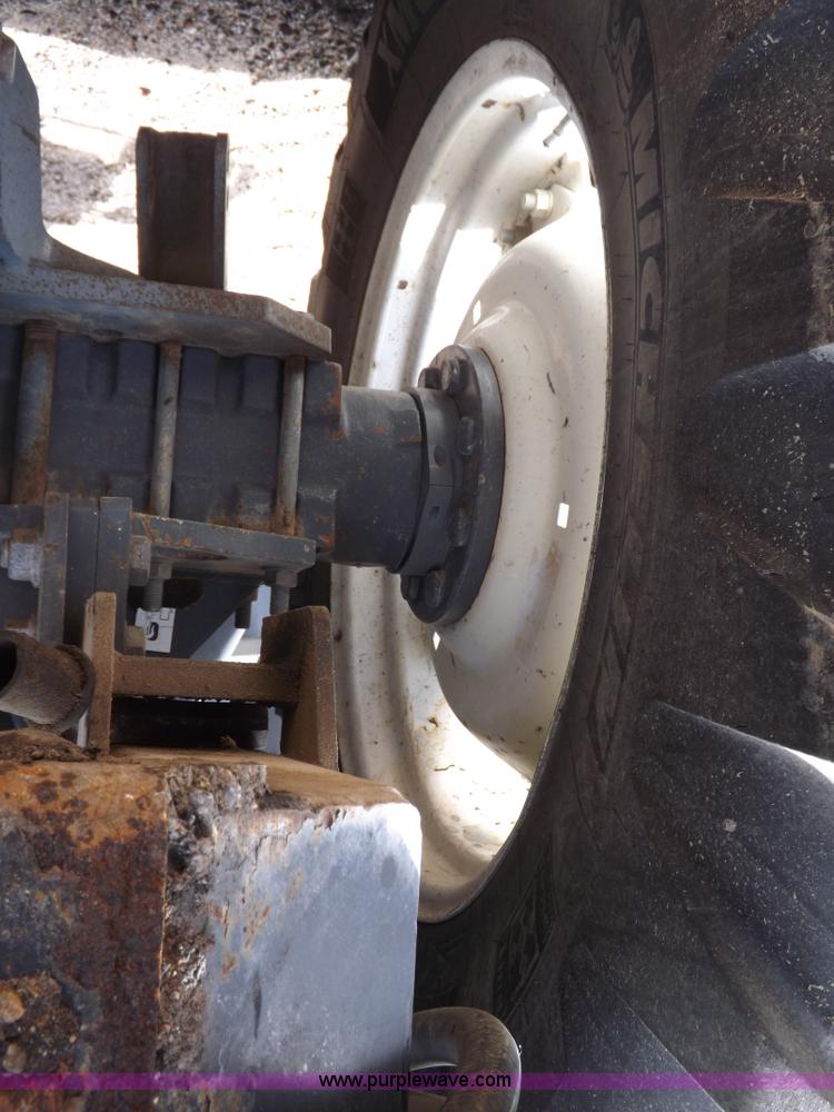 image for item H9106 1999 New Holland TV140 bi-directional MFWD tractor