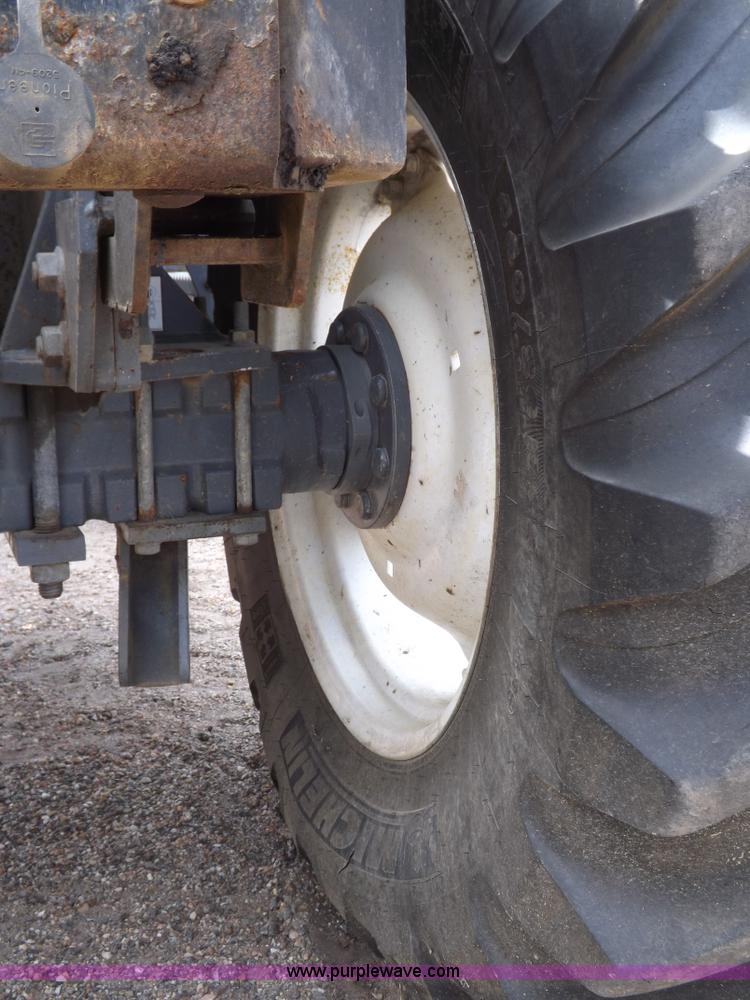 image for item H9106 1999 New Holland TV140 bi-directional MFWD tractor