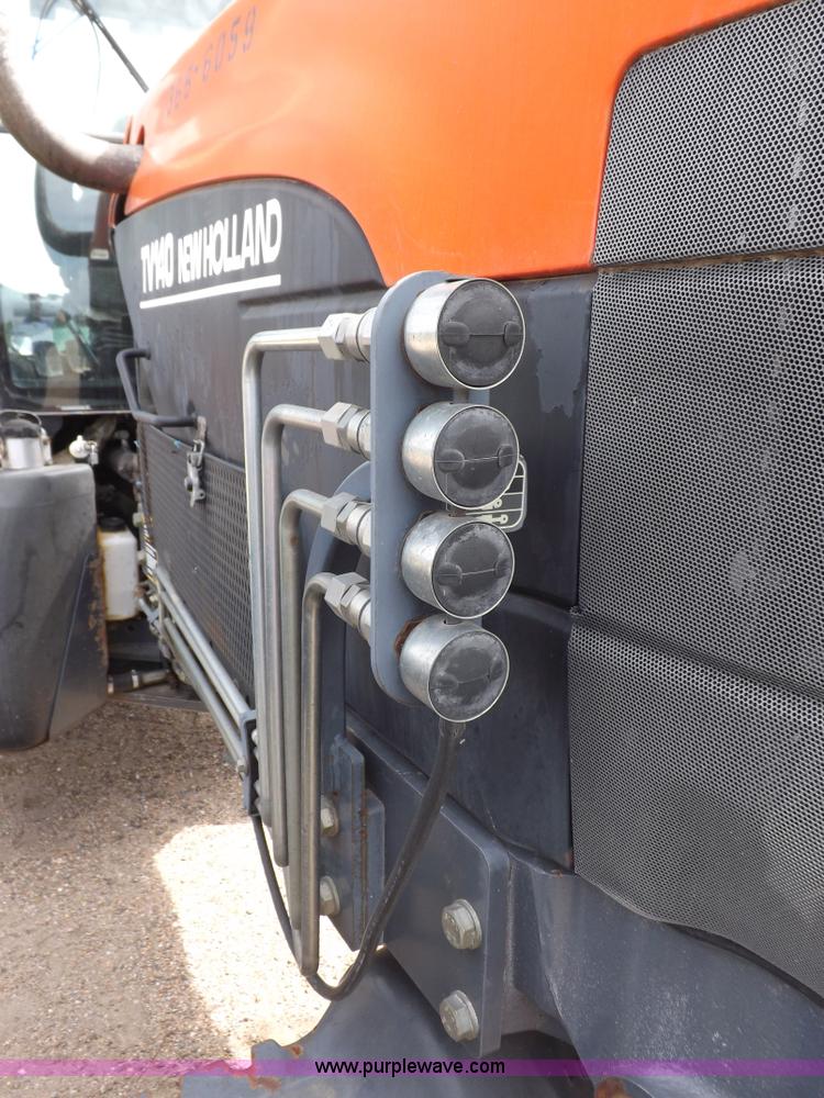 image for item H9106 1999 New Holland TV140 bi-directional MFWD tractor