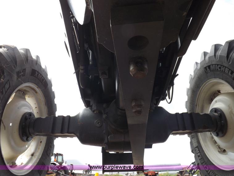 image for item H9106 1999 New Holland TV140 bi-directional MFWD tractor