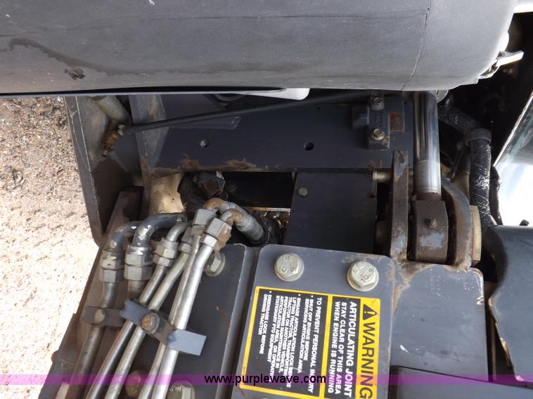 image for item H9106 1999 New Holland TV140 bi-directional MFWD tractor