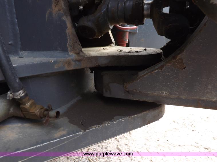 image for item H9106 1999 New Holland TV140 bi-directional MFWD tractor