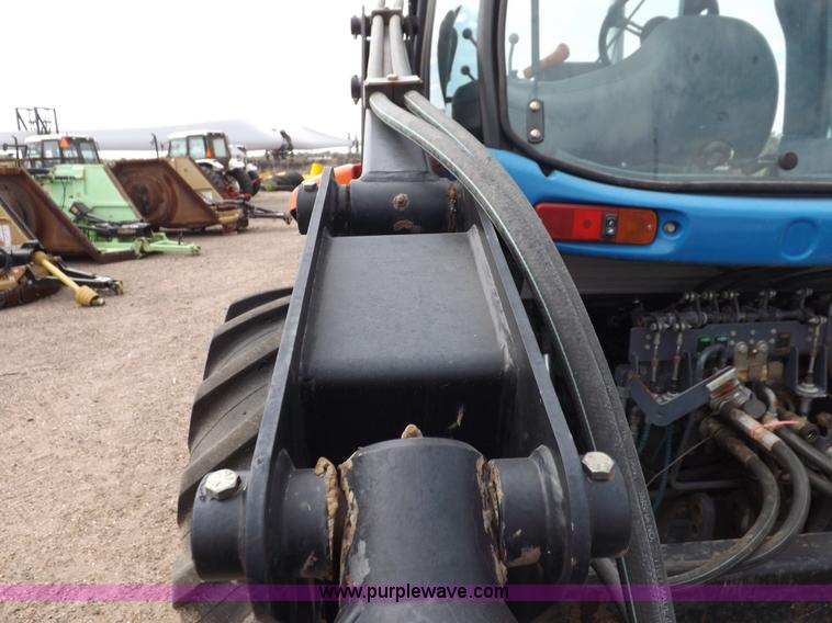 image for item H9106 1999 New Holland TV140 bi-directional MFWD tractor