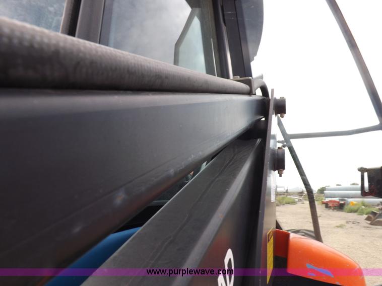 image for item H9106 1999 New Holland TV140 bi-directional MFWD tractor