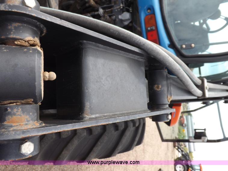 image for item H9106 1999 New Holland TV140 bi-directional MFWD tractor