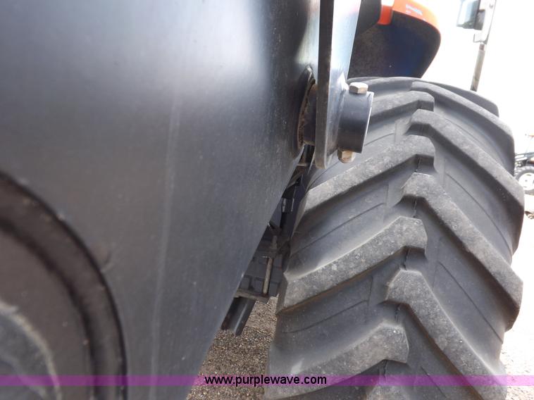 image for item H9106 1999 New Holland TV140 bi-directional MFWD tractor