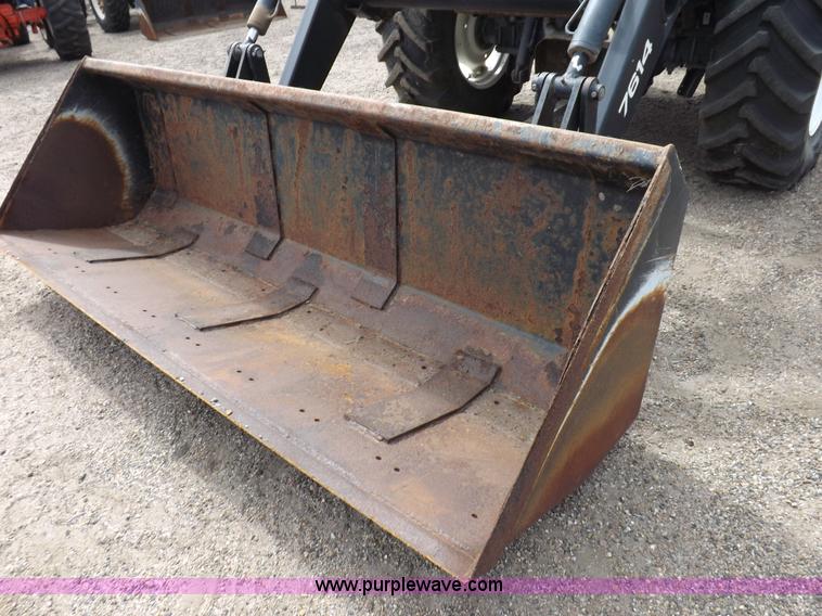 image for item H9106 1999 New Holland TV140 bi-directional MFWD tractor