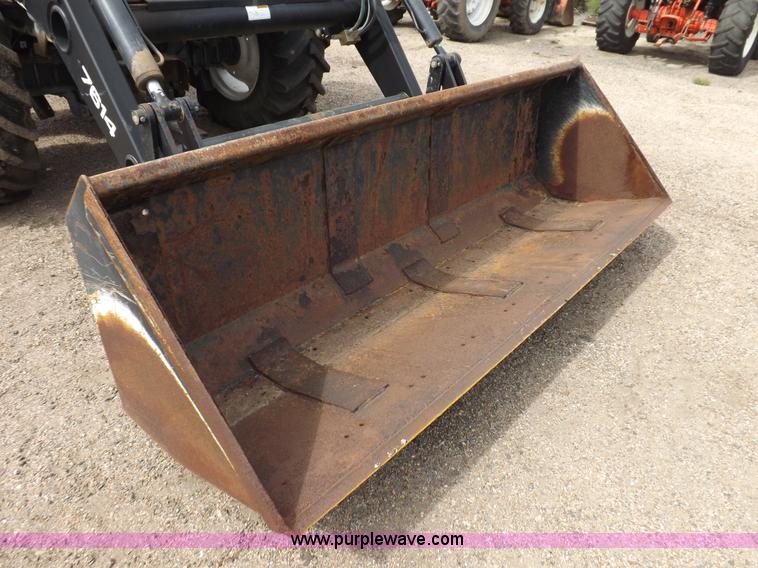 image for item H9106 1999 New Holland TV140 bi-directional MFWD tractor