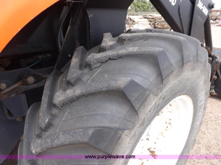 image for item H9106 1999 New Holland TV140 bi-directional MFWD tractor