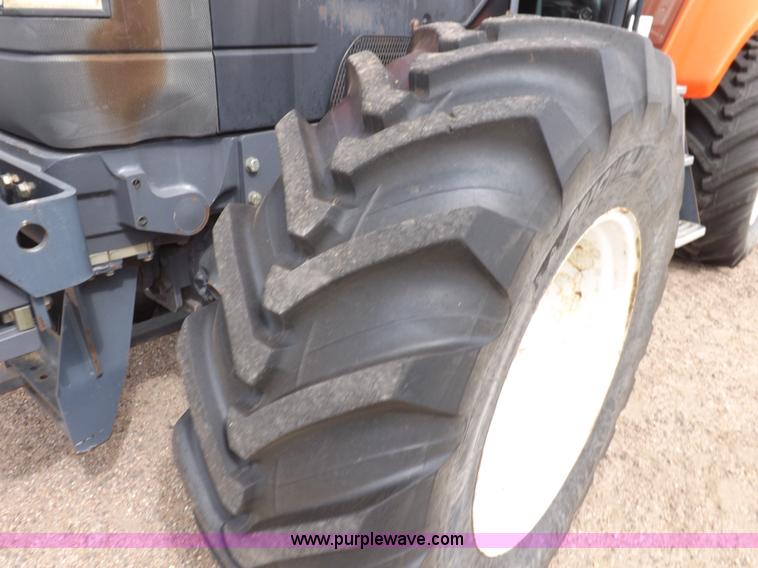 image for item H9106 1999 New Holland TV140 bi-directional MFWD tractor