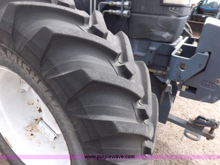 image for item H9106 1999 New Holland TV140 bi-directional MFWD tractor