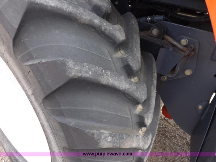 image for item H9106 1999 New Holland TV140 bi-directional MFWD tractor