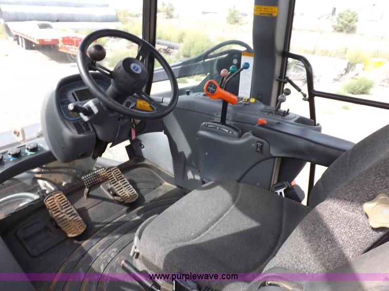 image for item H9107 1999 New Holland TV140 bi-directional MFWD tractor