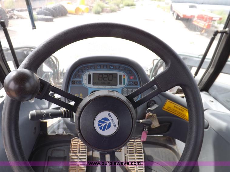 image for item H9107 1999 New Holland TV140 bi-directional MFWD tractor