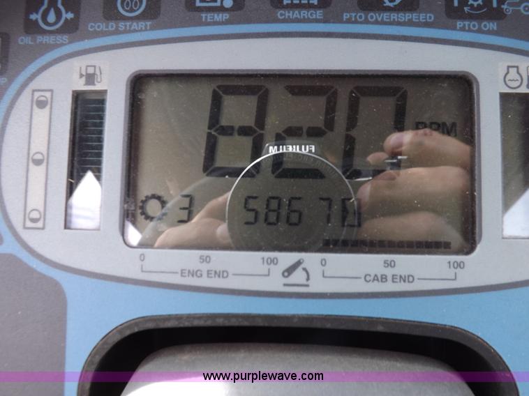 image for item H9107 1999 New Holland TV140 bi-directional MFWD tractor