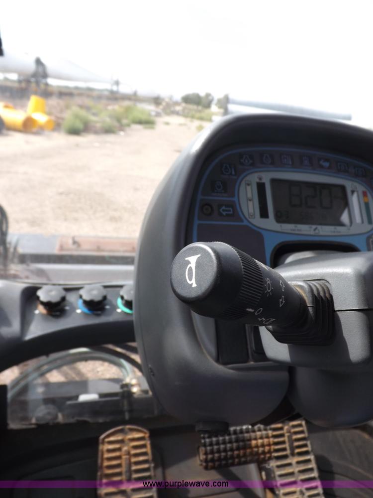 image for item H9107 1999 New Holland TV140 bi-directional MFWD tractor